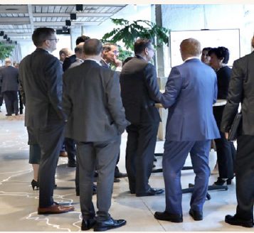 Guests mingling at a conference reception