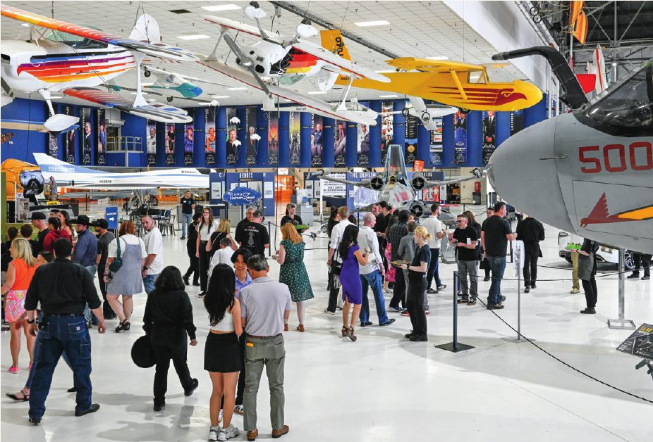 A company celebration inside an aircraft museum